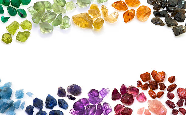 Colorful rough gemstones in a rainbow arc symbolize good fortune and their meanings.