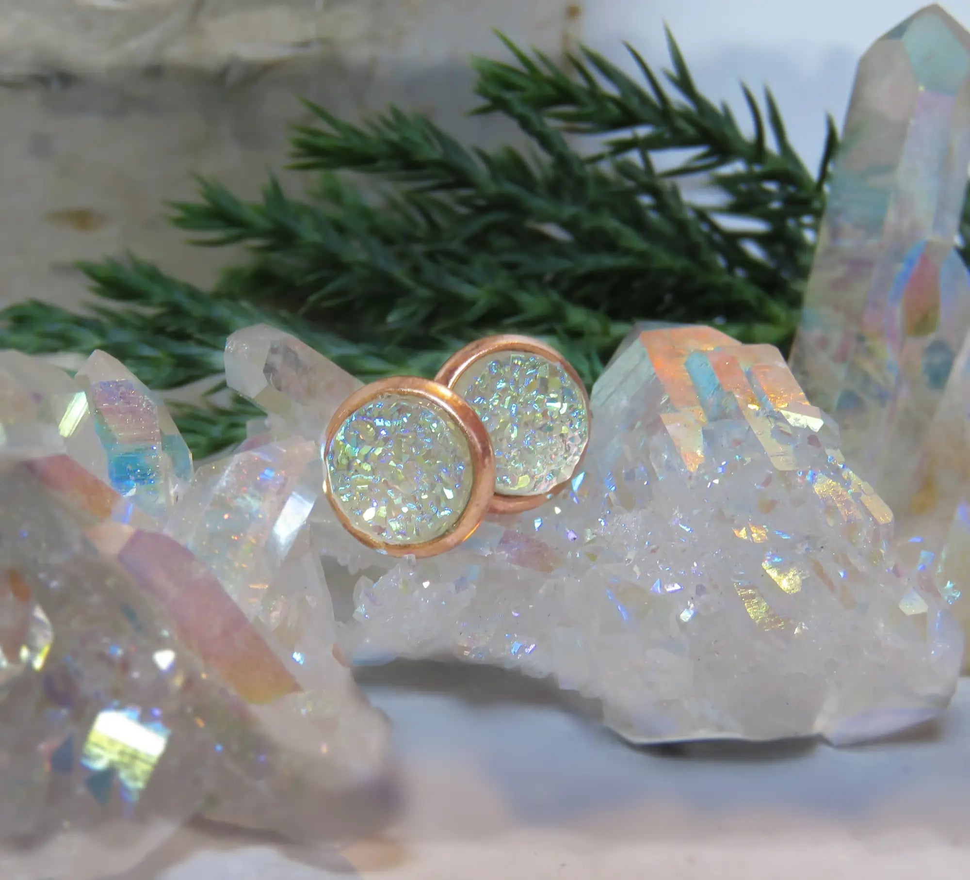 Sparkly druzy stud earrings with rose gold settings and beautifully colored crystals.