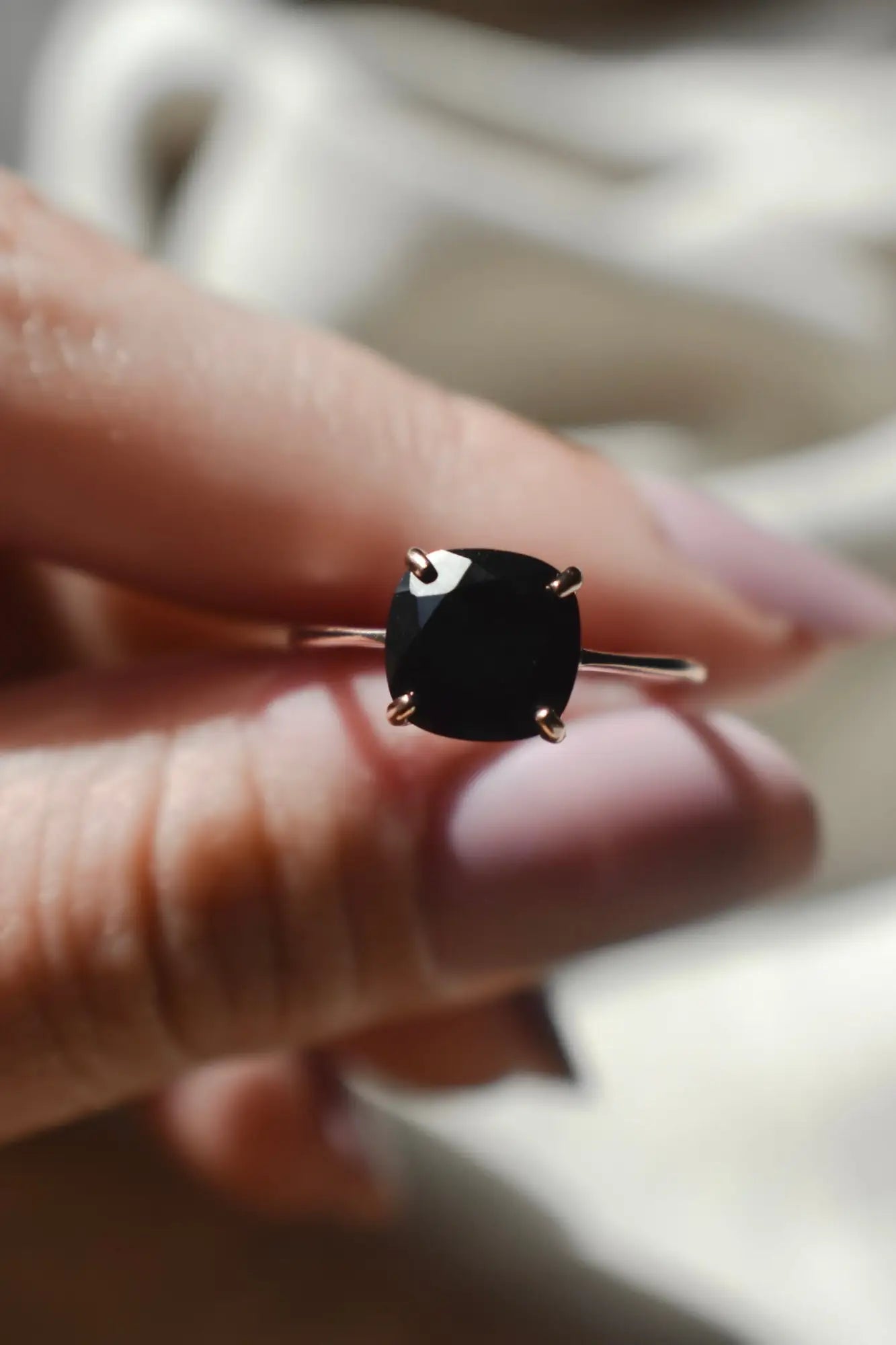 Silver ring with square black Onyx gemstone, showcasing its mental healing properties.