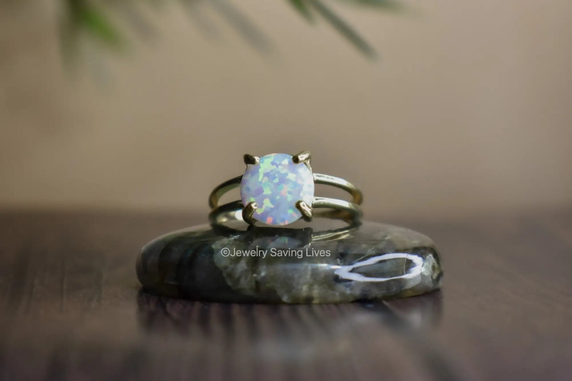 Opal ring with silver-toned band in October Birthstone collection featuring Welo Opal