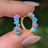 The Legacy Earrings - Blue and Purple Opal Hoops