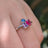 The Tulia - Bisexual 3 Stone Cluster Ring