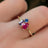 The Tulia - Bisexual 3 Stone Cluster Ring