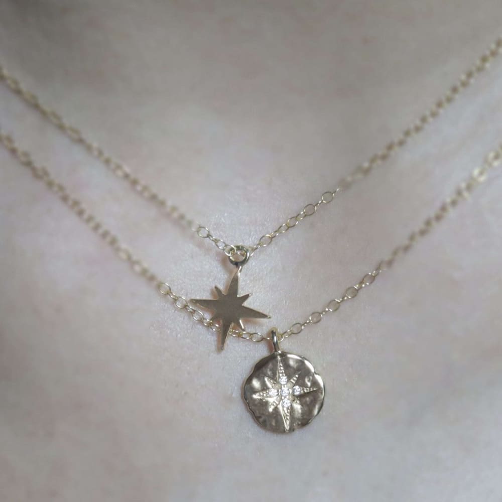 Silver layered celestial coin necklace with star charms on delicate chains