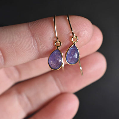 Natural Teardrop Tanzanite earrings with gold wire hooks, elegant and vibrant design