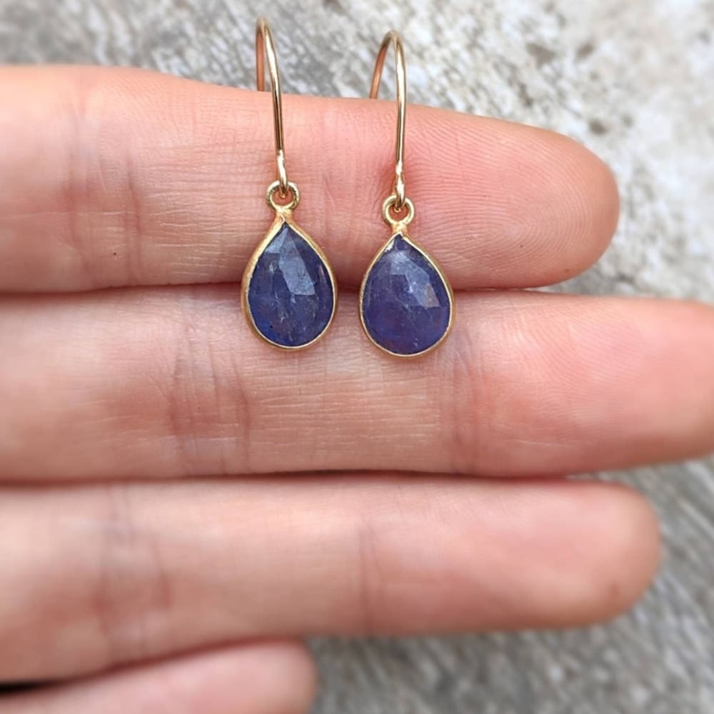 Natural Teardrop Tanzanite Dangles featuring blue sapphire earrings with gold-tone hooks