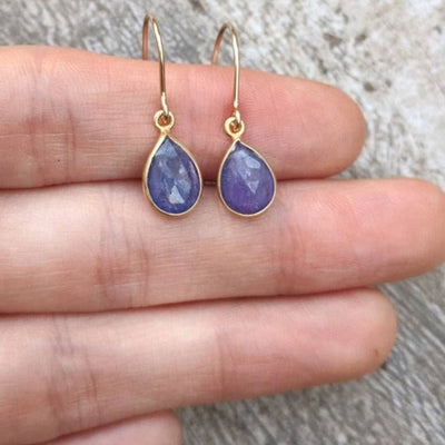 Natural Teardrop Tanzanite Dangles featuring teardrop-shaped tanzanite earrings with gold hooks