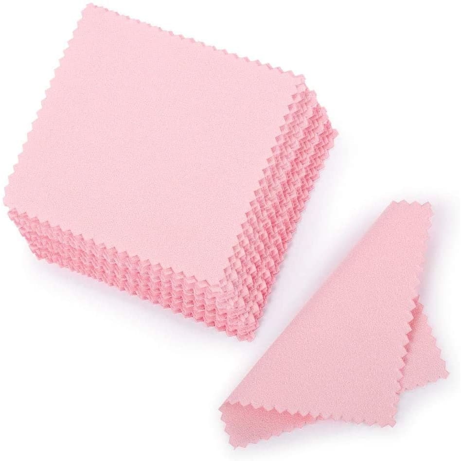 Stack of pink microfiber cleaning cloths with zigzag edges for effective polishing