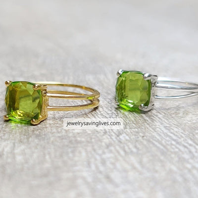 Two rings with cushion-cut natural peridot in double band gold and silver settings