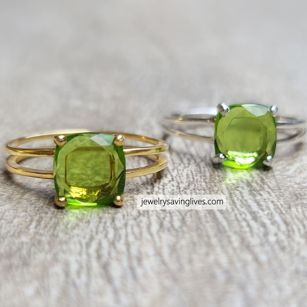 Two rings with cushion-cut natural peridot in gold and silver double band settings