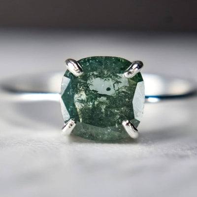 Square-cut glowing teal diamond ring set in silver prongs, The Asher GBD003