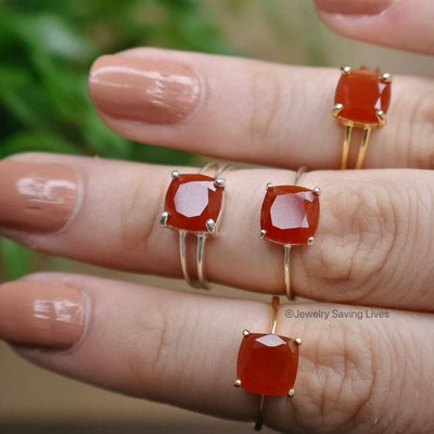 Four gold rings with cushion-cut natural carnelian gemstones in The Asher collection