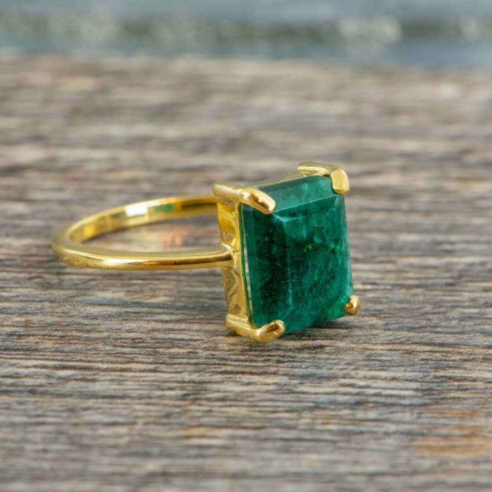 Gold-plated natural emerald ring featuring an emerald-cut gemstone named The Audrey