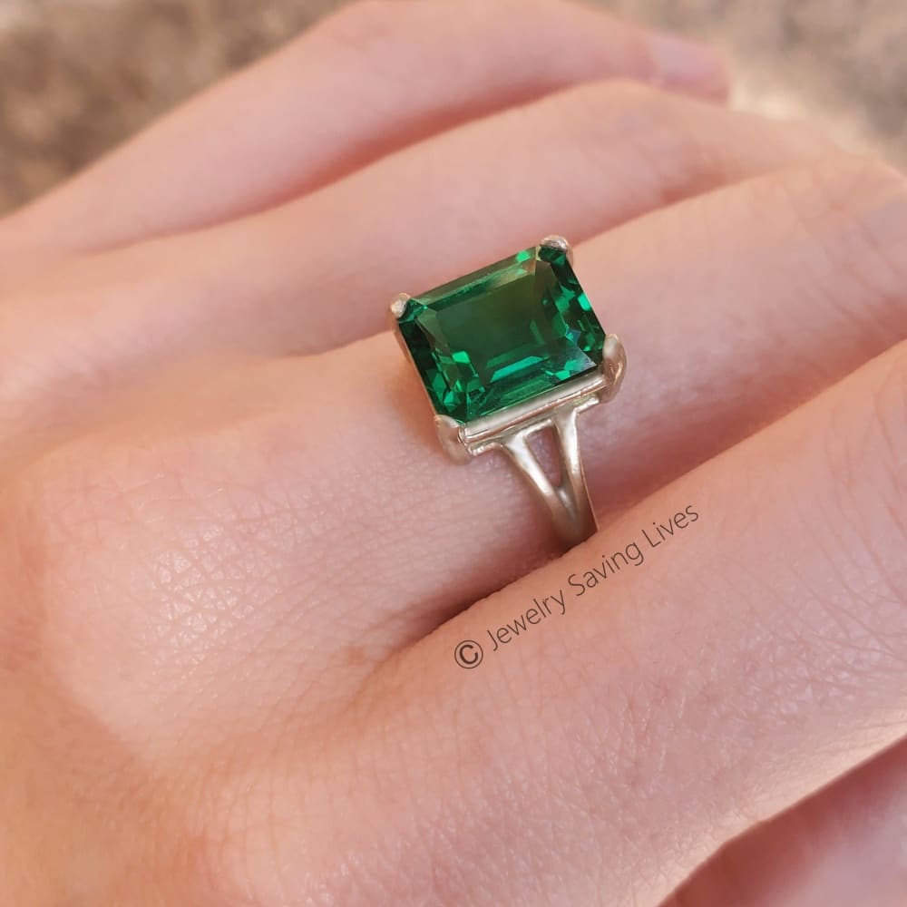 Emerald-cut green gemstone ring in silver metal, The Audrina Emerald Ring design